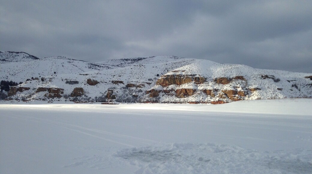 Sun hitting the cliffs in the middle of the storm. #ice #winter #snow