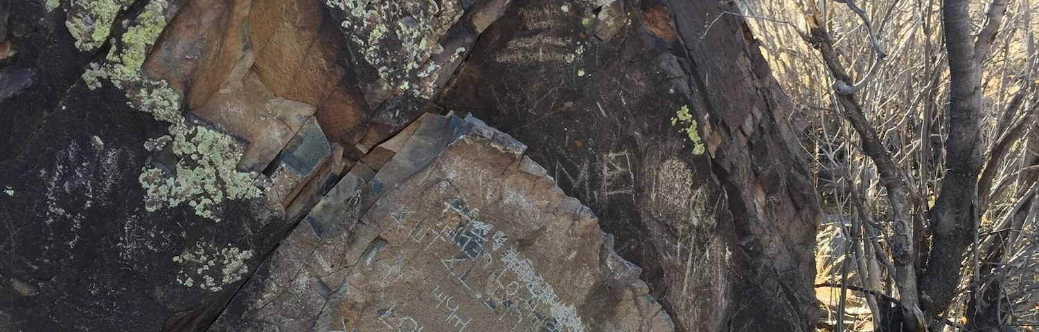 The Decalogue stone is nestled in a canyon on Hidden Mountain, about a mile hike from the nearest road. The inscription has been interpreted as an abbreviated version of the Ten Commandments written in an ancient form of Hebrew, but there is no evidence of its authenticity.