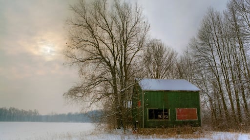 An old style tobacco kiln at sunset