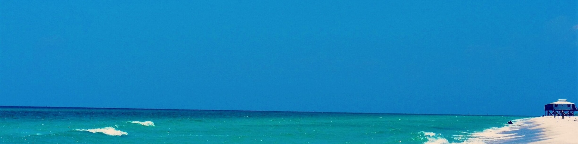 This beach and it's pristine water are accessible only by boat. This side on the Gulf Of Mexico is an Aquatic Preserve. The bay side is on St Andrews Bay. It is a favorite place for local boaters to gather.