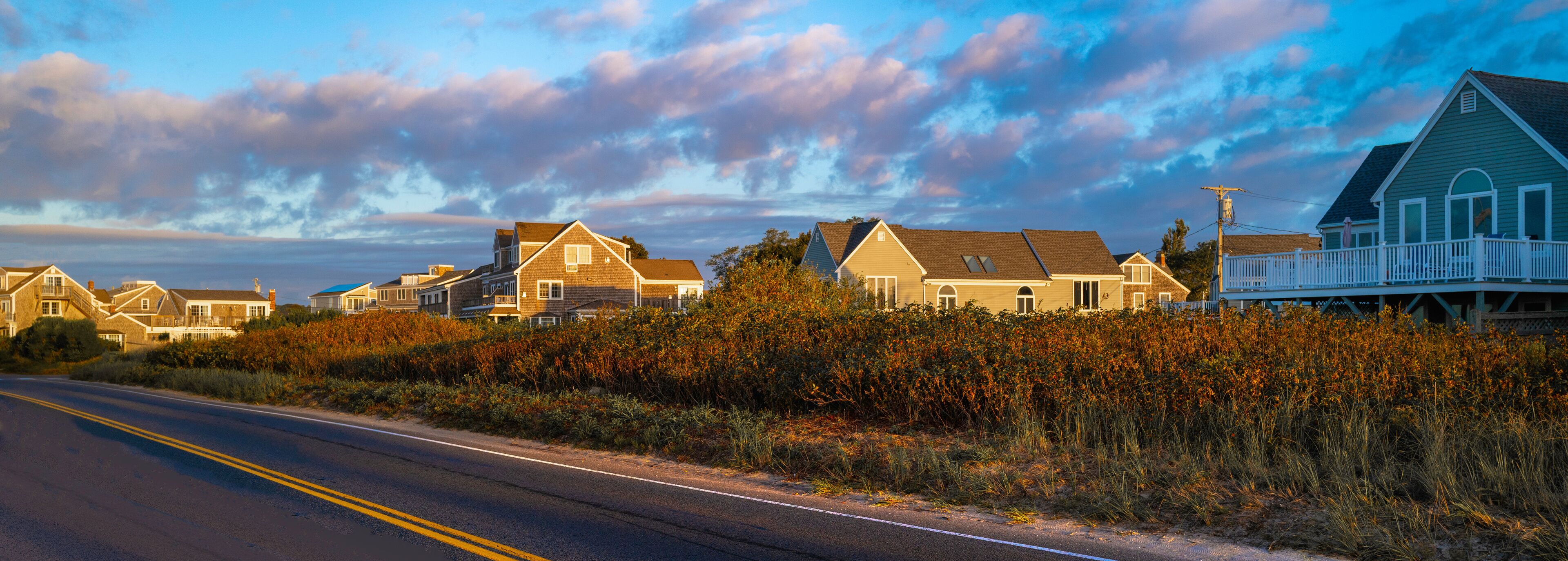 Dramatic cloudscape over the coastal village along the shore road on Cape Cod
