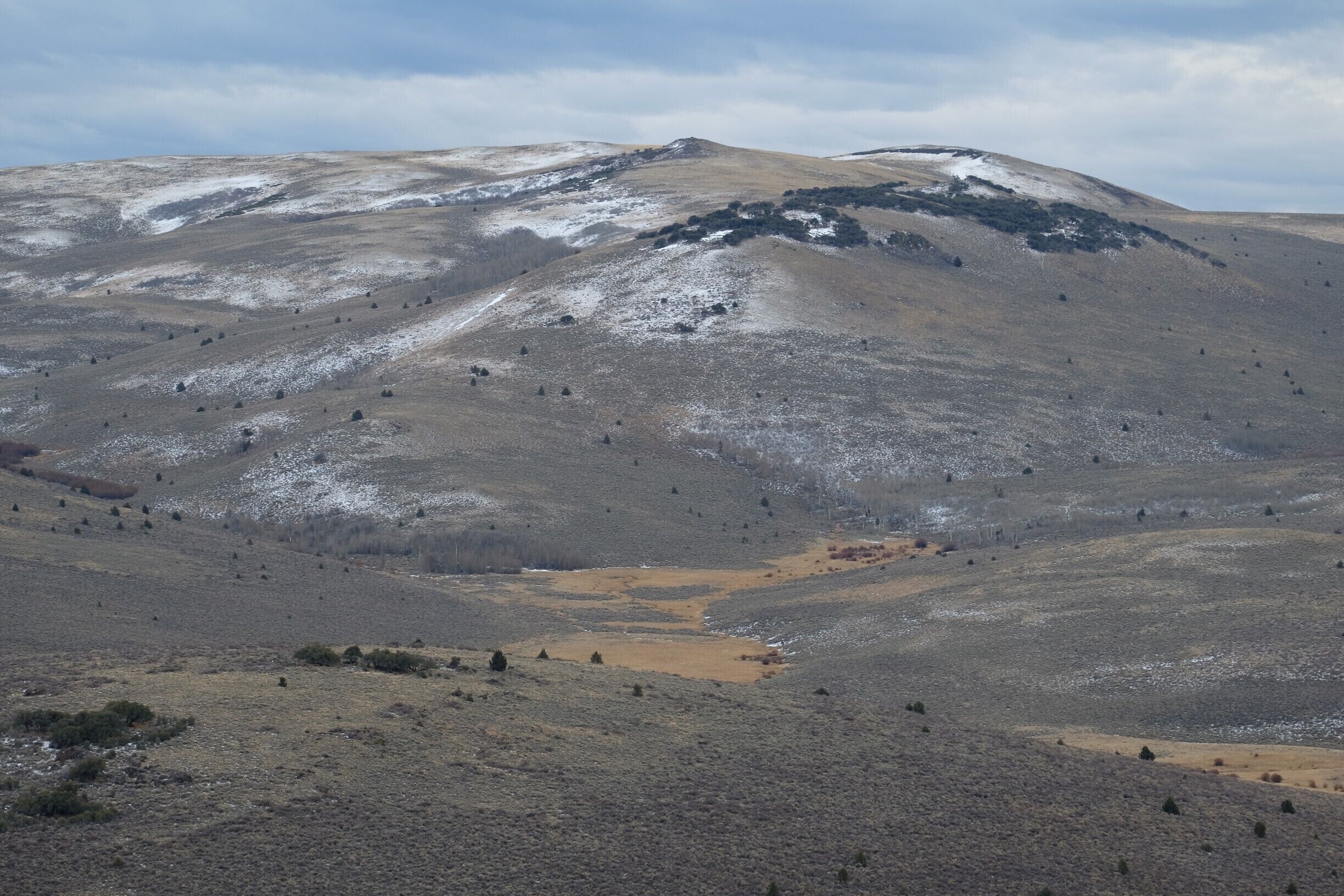 There are hot springs in the valley below.  Years ago, an old rancher dynamited a hole in the granite and exposed a nice spot to dip in.   