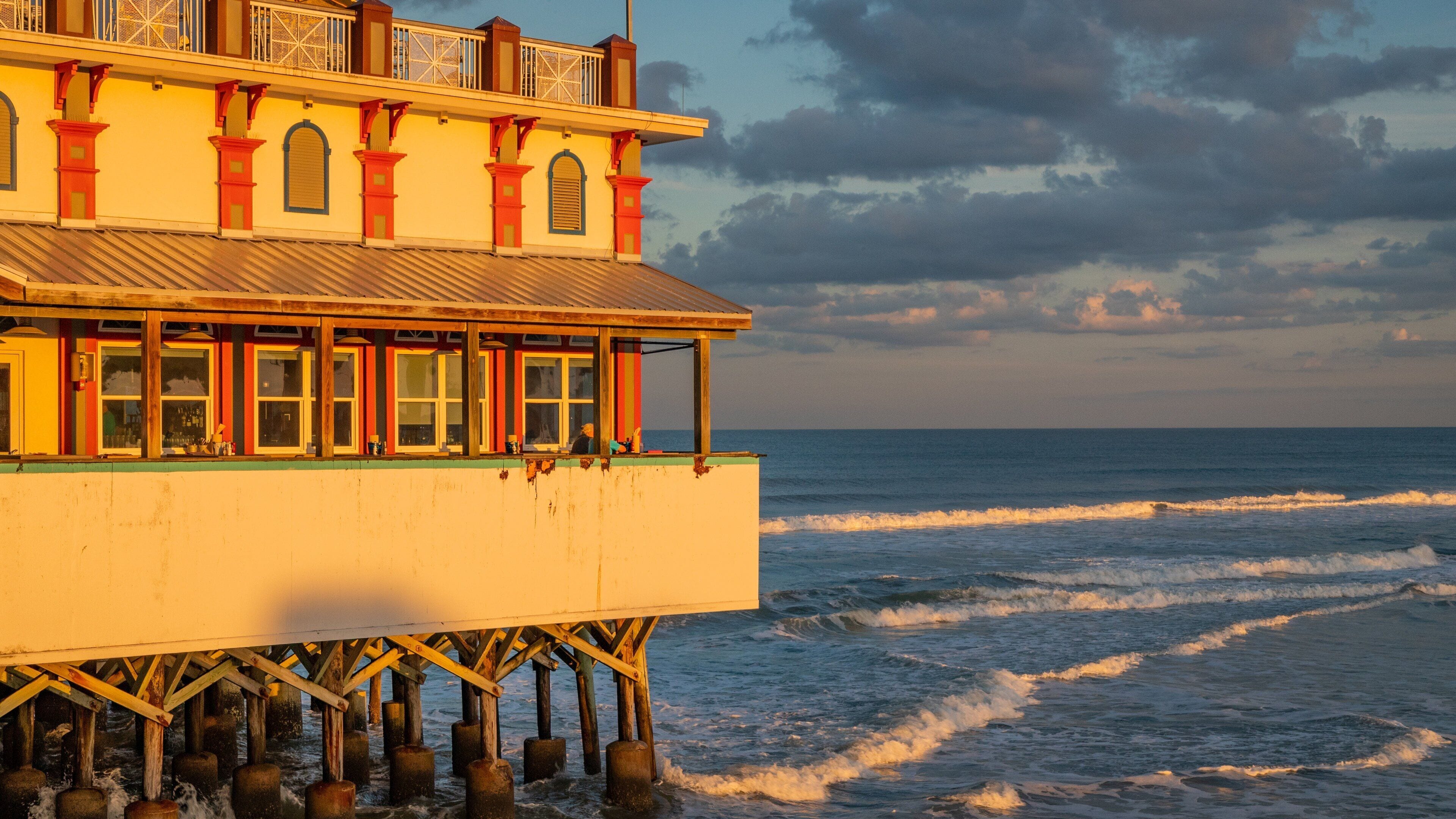 Daytona Beach Pier showing general coastal views and a sunset
