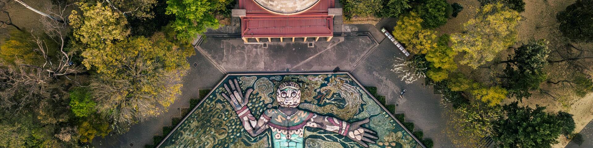 Aerial view of Carcamo de Dolores with beautiful mural and historic architecture surrounded by greenery, Miguel Hidalgo, Mexico.