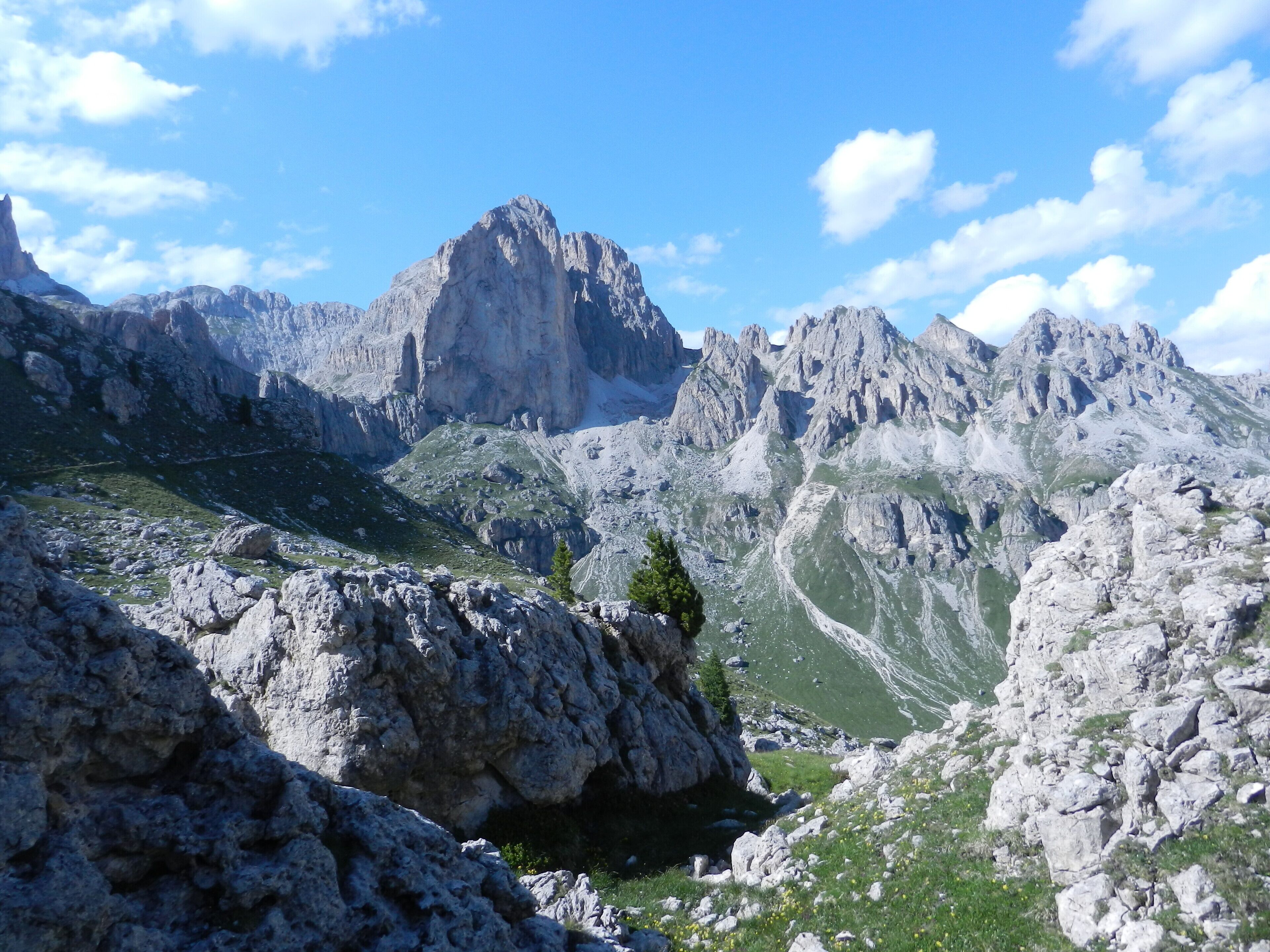 Rugged mountain terrain with rocky outcrops and a prominent peak.