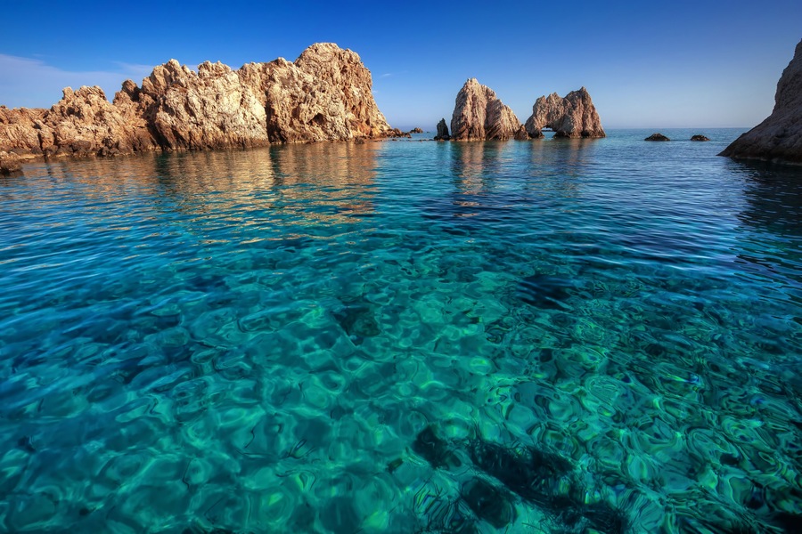 A little islet with fantastic transparent waters, Antiparos island, Cyclades, Greece
