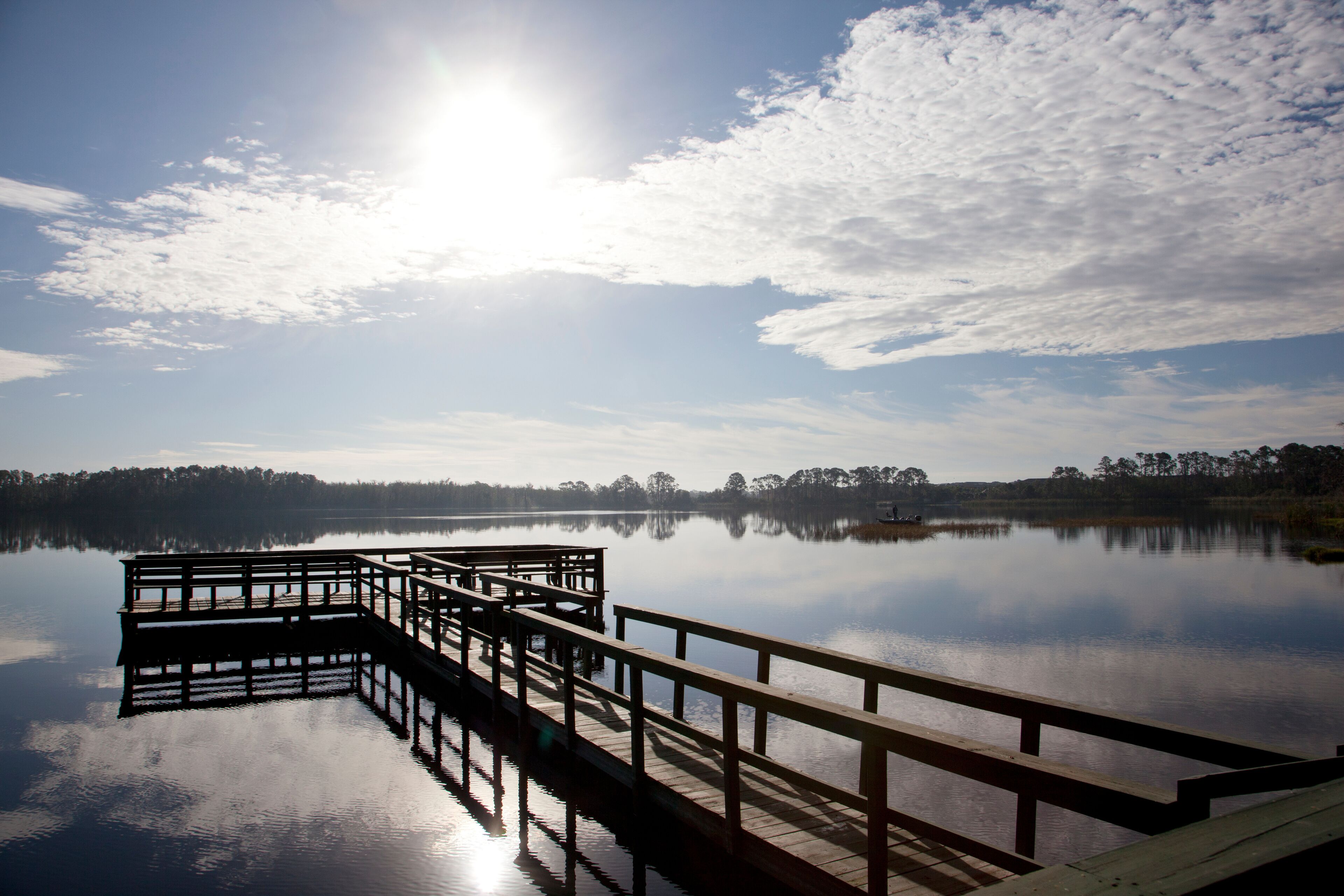 fishing pier on a blue sky day