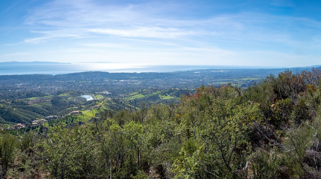 Father and son hiking on Jesusita Trail with panoramic view of ocean and Channel Islands, Santa Barbara, California, USA