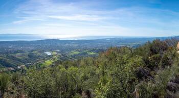 Father and son hiking on Jesusita Trail with panoramic view of ocean and Channel Islands, Santa Barbara, California, USA