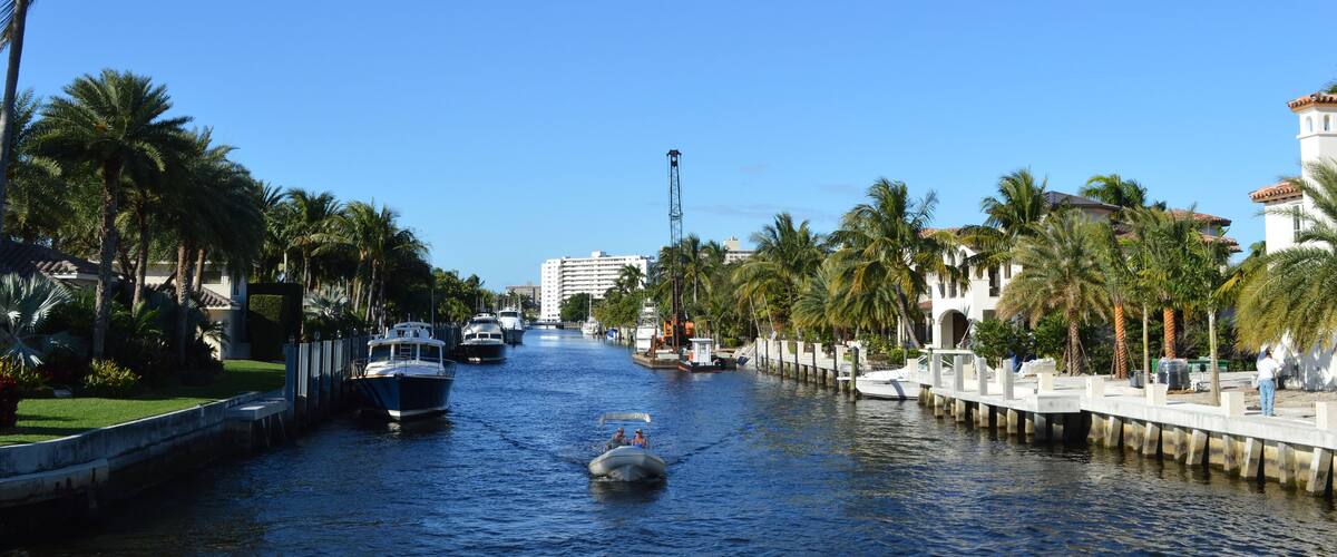 Local people on a canoe cruising on Fort Lauderdale Canals, Florida, USA