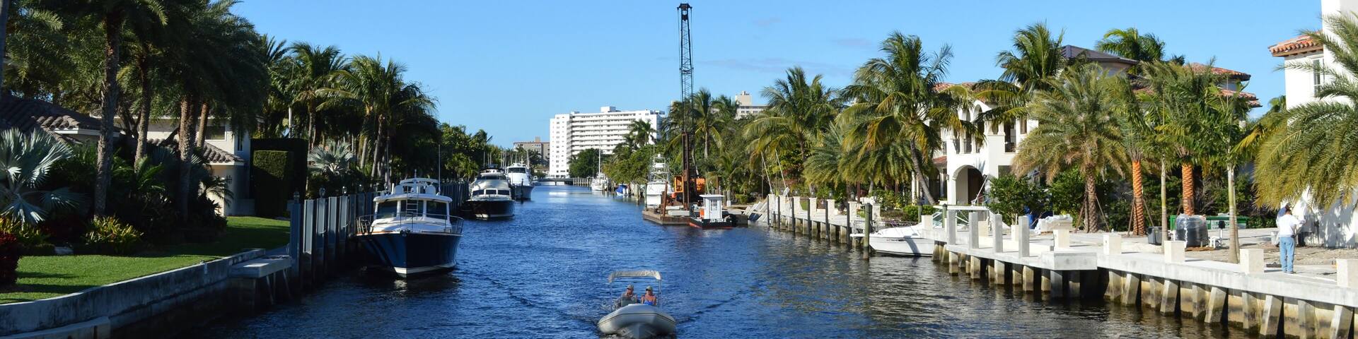 Local people on a canoe cruising on Fort Lauderdale Canals, Florida, USA