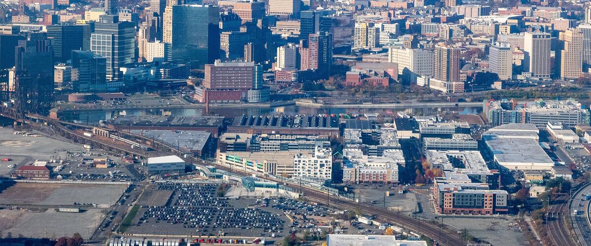 Aerial view of Newark, New Jersey shows a dense urban landscape with a mix of modern skyscrapers and older buildings.