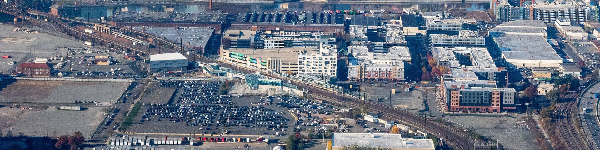 Aerial view of Newark, New Jersey shows a dense urban landscape with a mix of modern skyscrapers and older buildings.
