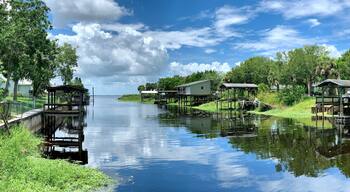 Boat docks lining a canal leading to a freshwater lake in central Florida