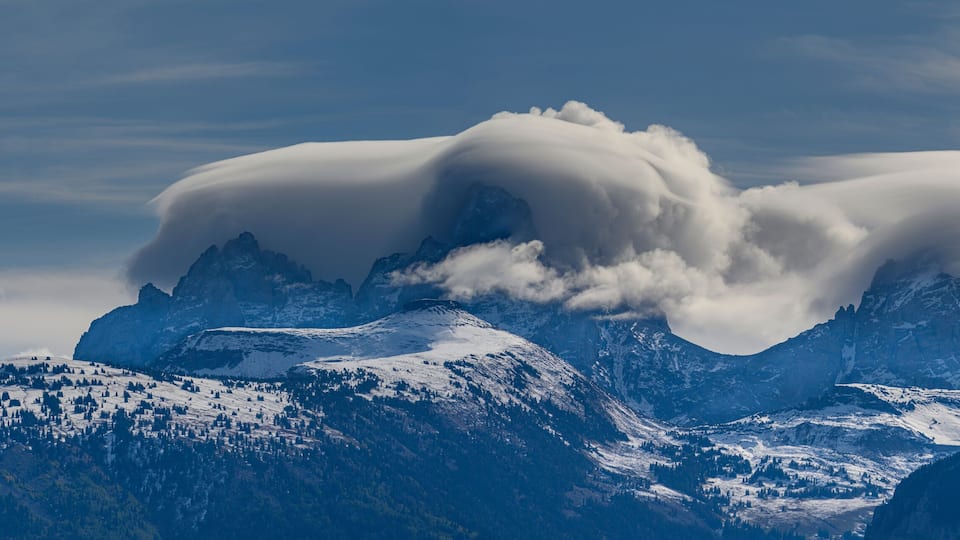 USA, Wyoming. Panoramic of clouds blanketing Teton Mountains from the west