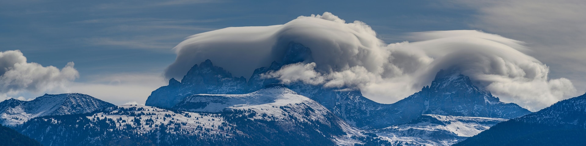 USA, Wyoming. Panoramic of clouds blanketing Teton Mountains from the west
