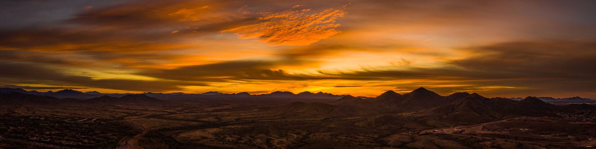 Panoramic image of a sunset over the Sonoran Desert of Arizona.