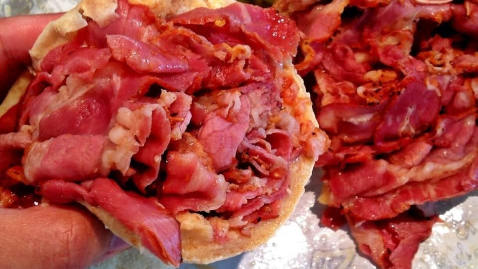 Hot double pastrami sandwich. They warm up the cold pastrami cuts in the hot seasoned broth before they make sandwich so the meat is still very juicy and not over cooked. The bread is freshly made as well.