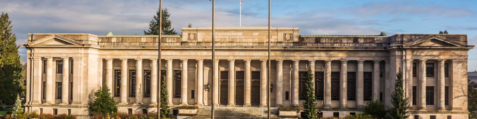 Washington State Temple of Justice Supreme Court law library flags front south morning golden hour