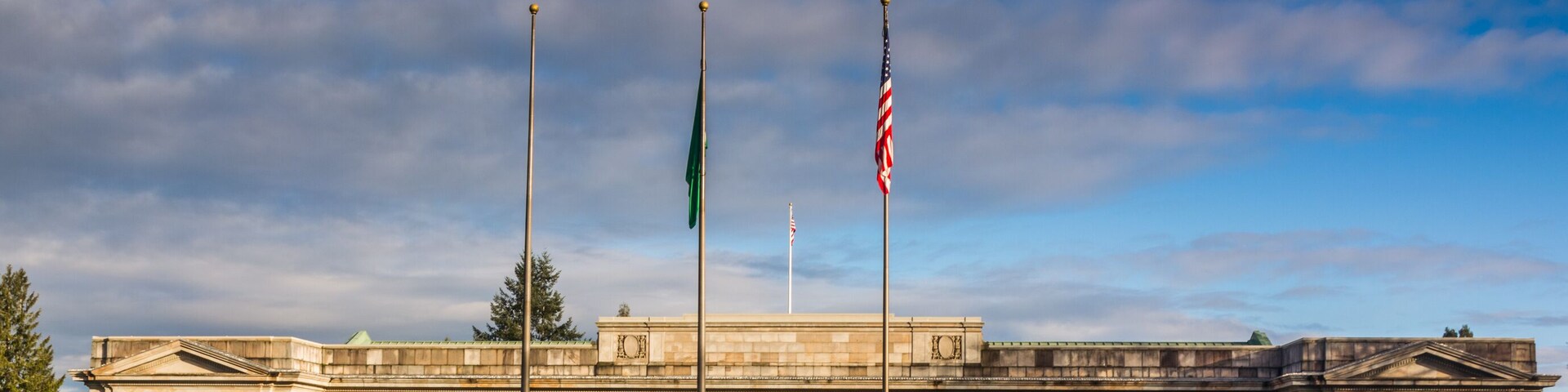Washington State Temple of Justice Supreme Court law library flags front south morning golden hour