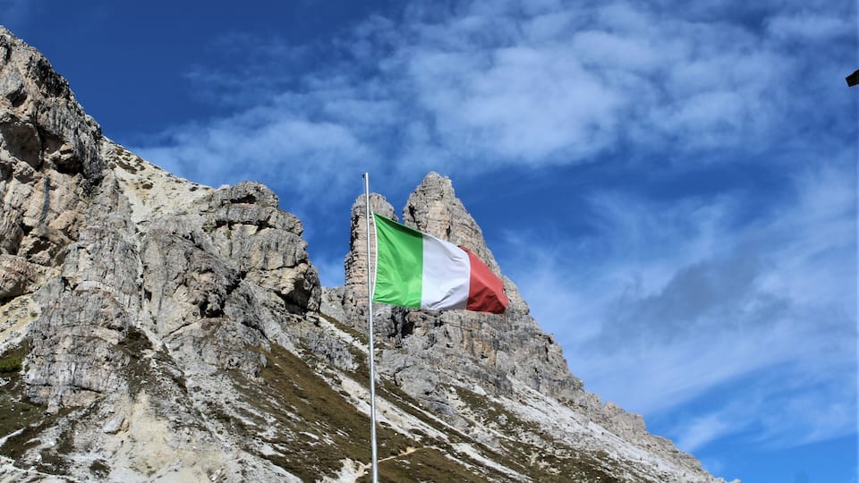 The Italian flag with the mountains
