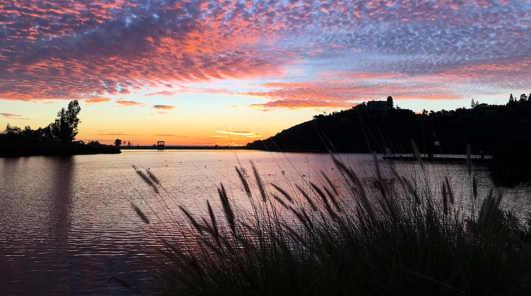Beautiful sunset over a quiet Lake Murray in San Diego California