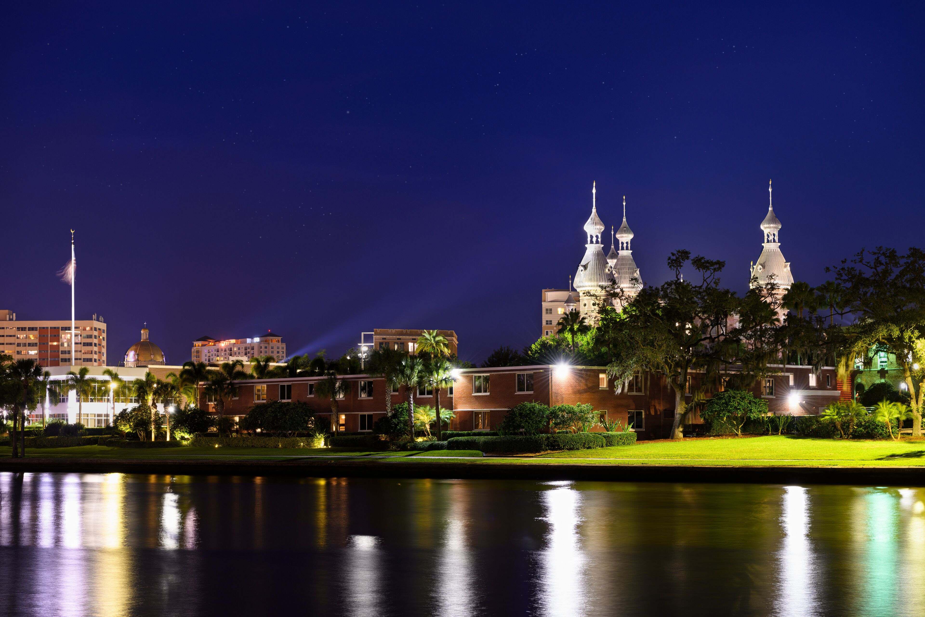 Long exposure of the Hillsborough River with the University of Tampa across the river and city buildings in the background.