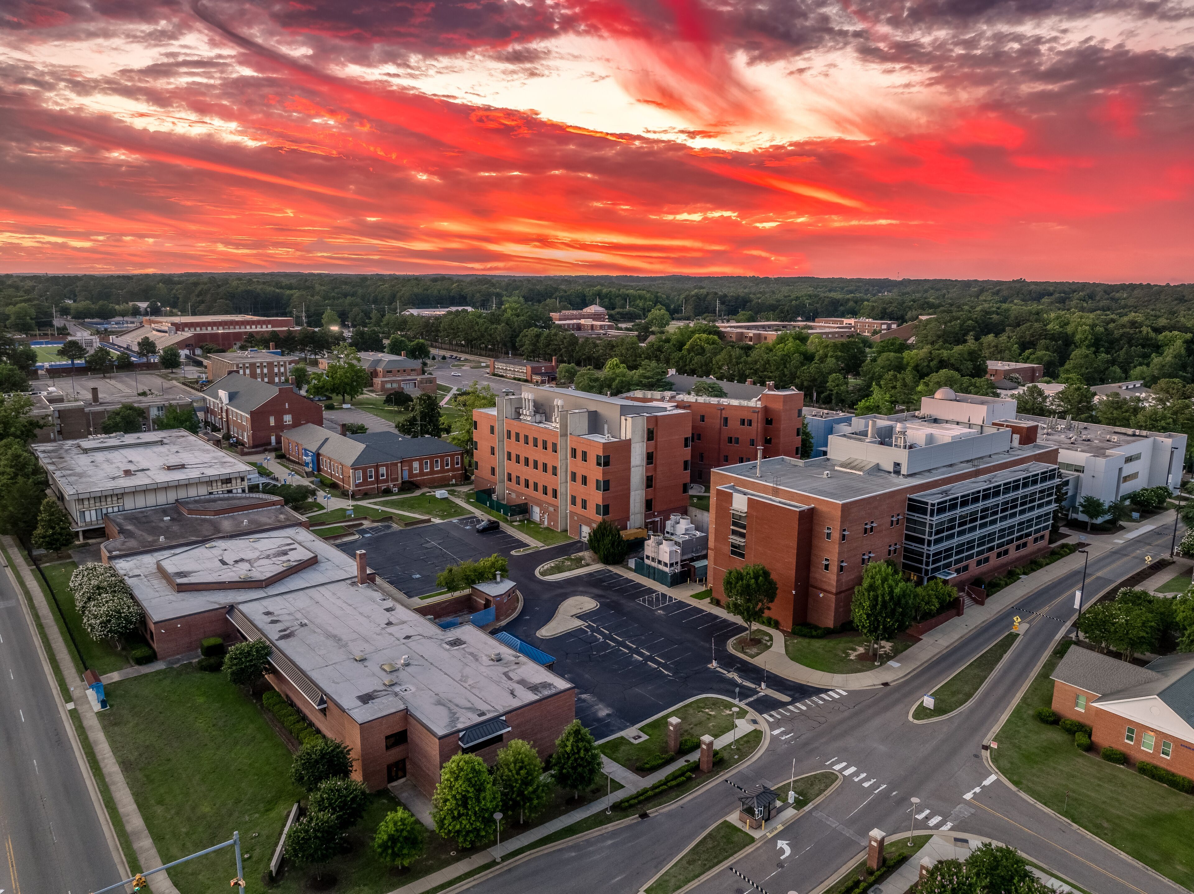 Aerial view of Fayetteville state university historically black college administration building with dramatic colorful sunset sky