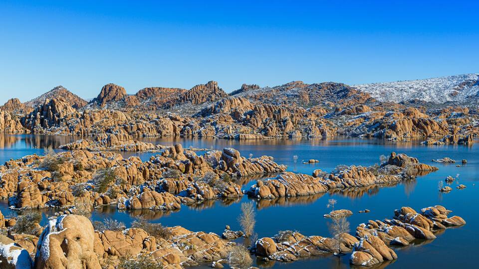 A panoramic winter image of Watson Lake in Prescott Arizona with the Granite Dells taken by a drone.