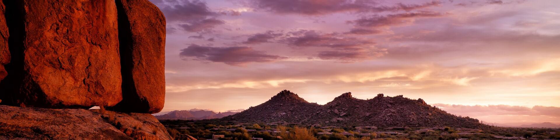 Scottsdale, Arizona, Pinnacle Peak Sonoran high desert vista. Red boulders glow in the last flickers of light before sundown over the Valley of the sun.