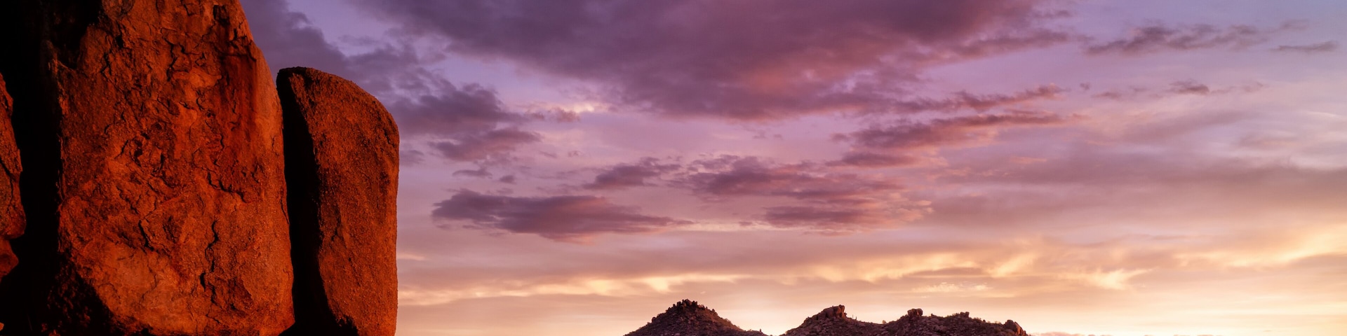 Scottsdale, Arizona, Pinnacle Peak Sonoran high desert vista. Red boulders glow in the last flickers of light before sundown over the Valley of the sun.