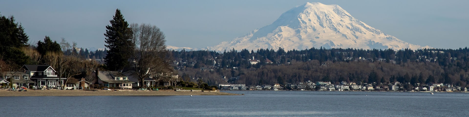 Mount Rainier as seen from south Puget Sound with Gig Harbor's Magnolia Heights waterfront houses in the foreground.