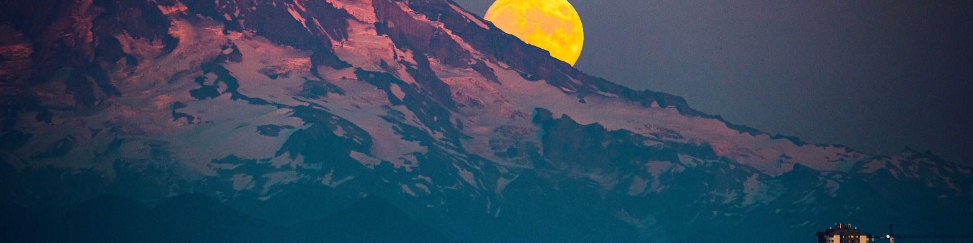 Moon rising over Mt Rainier viewed from Point Ruston in Tacoma Washington