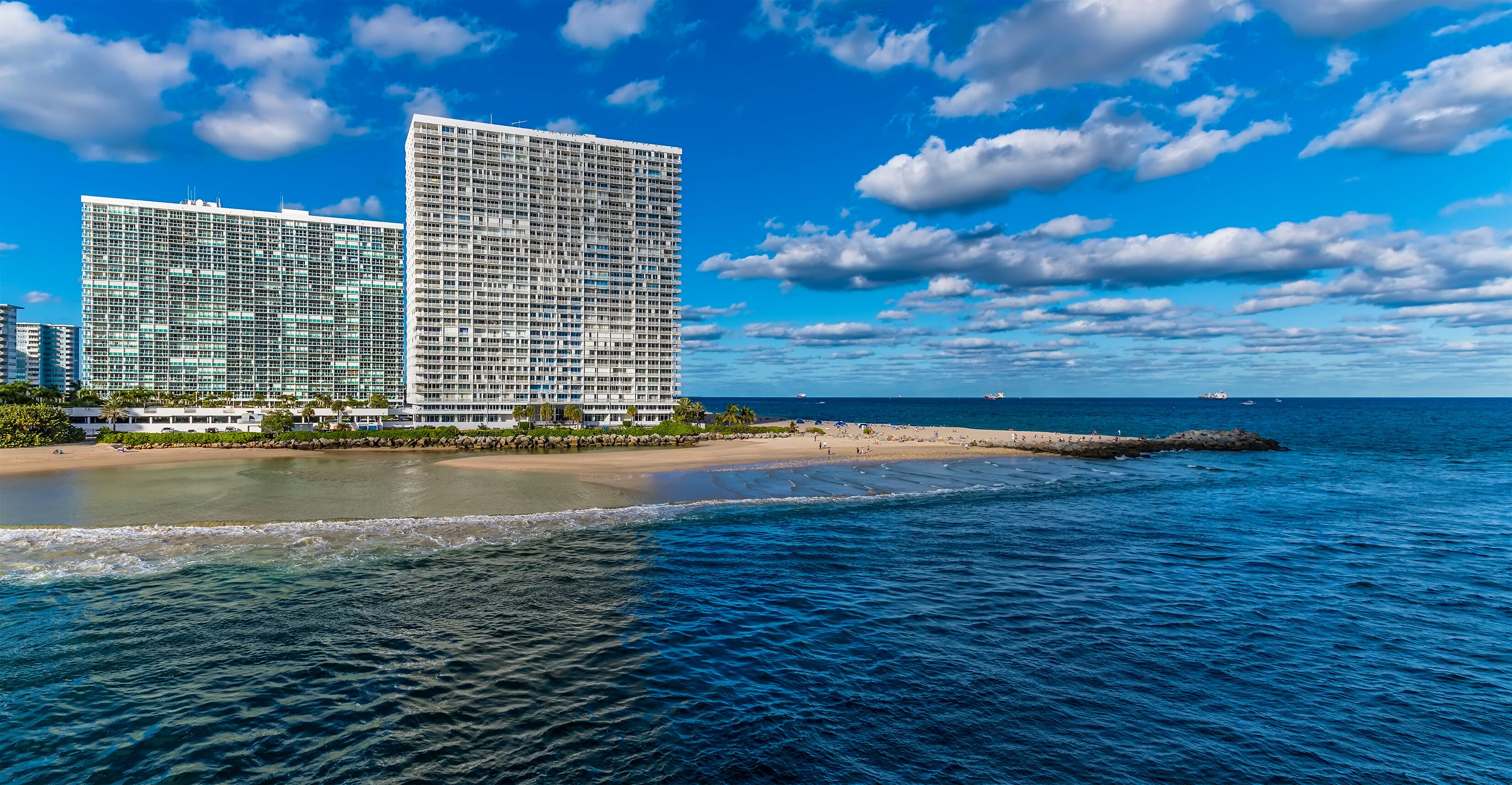 A view over the beach at the mouth of the Stranahan river from Port Everglades, Fort Lauderdale on a bright sunny day