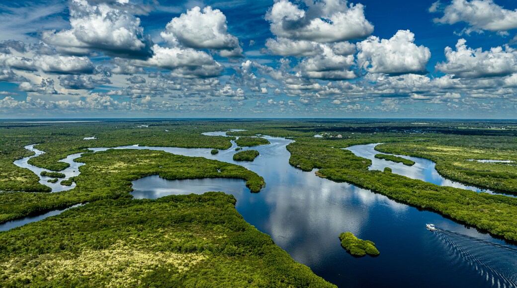 drone shot of boat going up the Peace River near Deep Creek
