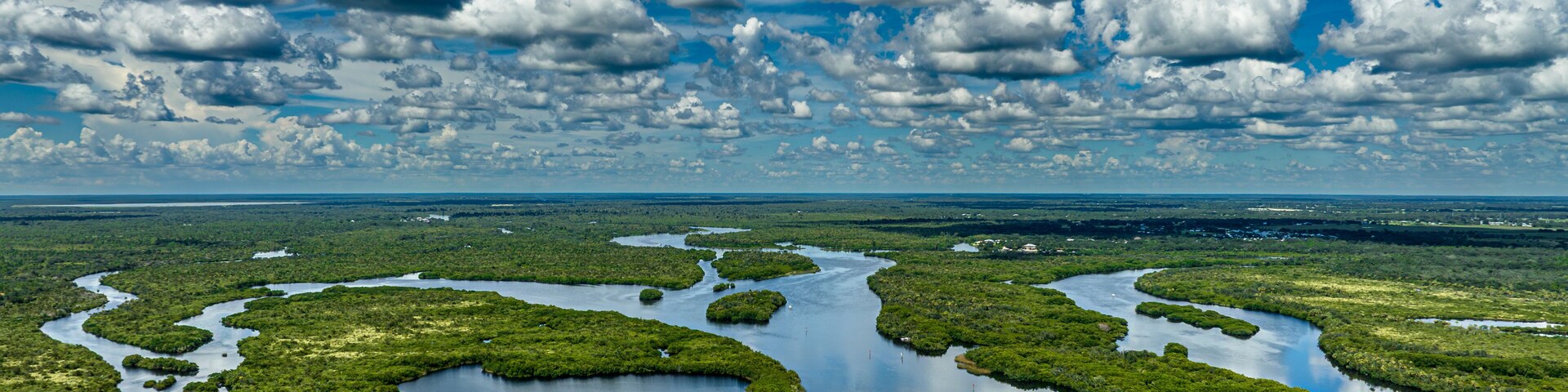 drone shot of boat going up the Peace River near Deep Creek