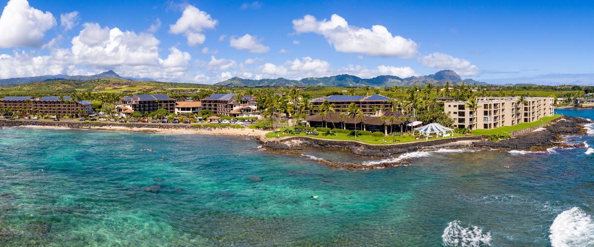 Wide panorama of the coastline around Lawa'i beach near Poipu on the south coast of Kauai