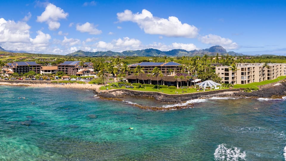 Wide panorama of the coastline around Lawa'i beach near Poipu on the south coast of Kauai