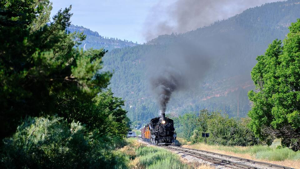 Panoramic image of The narrow gauge railroad locomotive under power between Durango and Silverton in Colorado