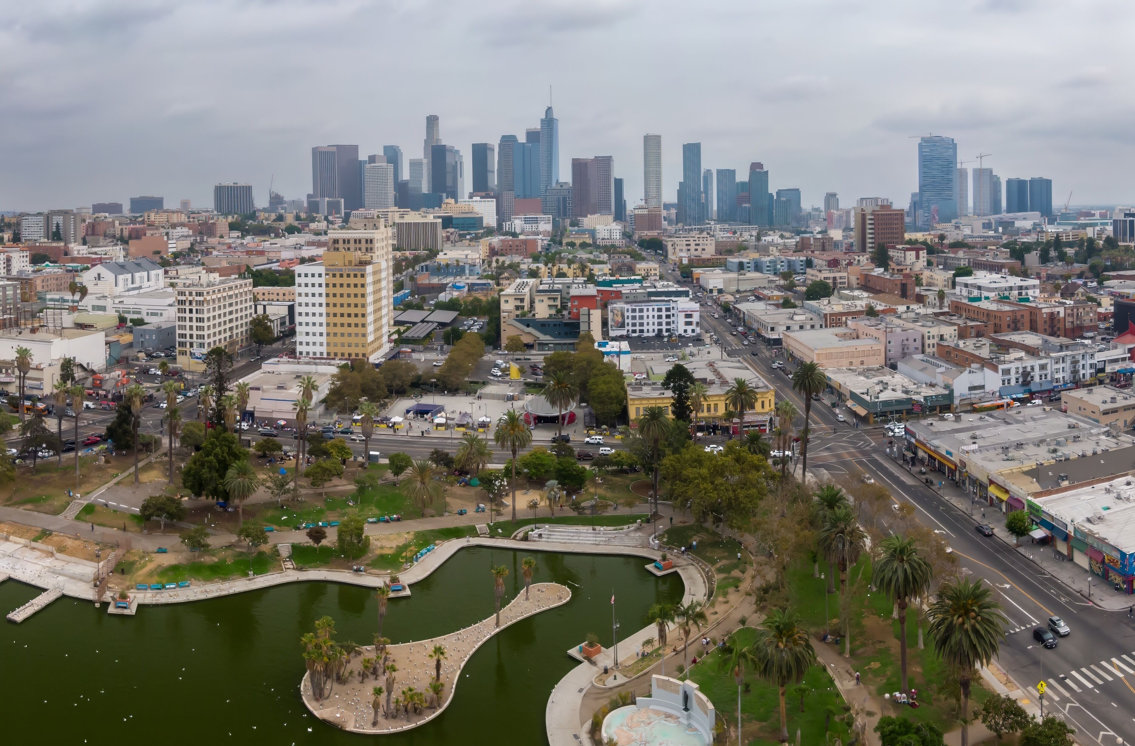 Macarthur Park in Los Angeles, California, USA, offers a green space for recreation and relaxation amidst the urban landscape, with the city skyline in the background.