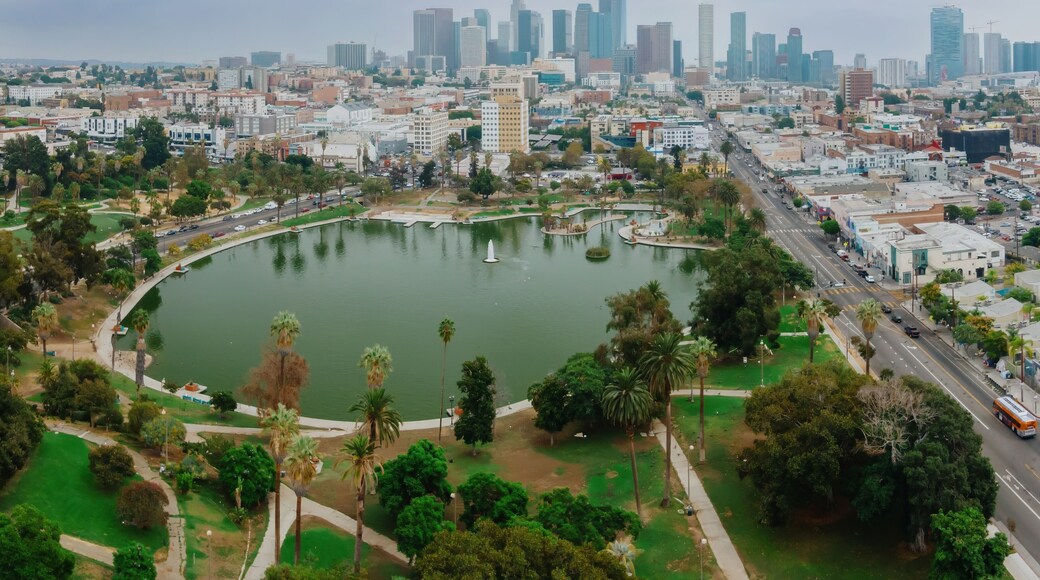 MacArthur Park in Los Angeles, California, USA, offers a green space for recreation and relaxation amidst the urban landscape. The downtown skyline rises in the background.