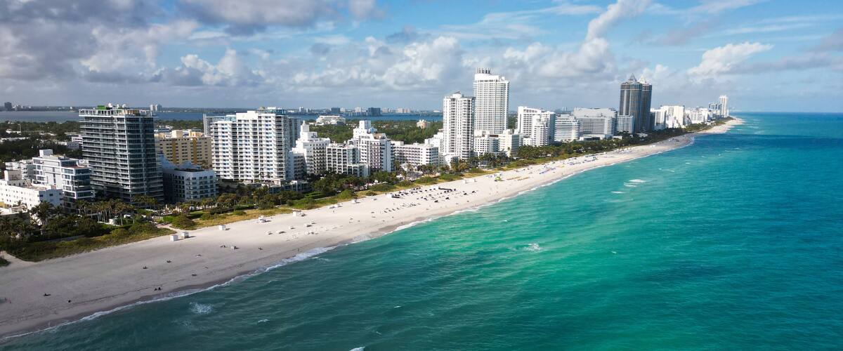 Miami cityscape with luxury skyscrapers and ocean. Panoramic view of Miami famous skyline. Miami Beach from above. Miami skyline from top.