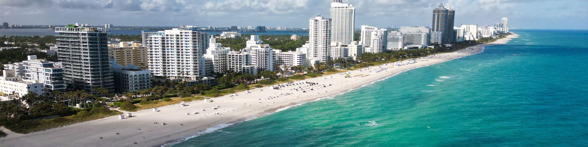 Miami cityscape with luxury skyscrapers and ocean. Panoramic view of Miami famous skyline. Miami Beach from above. Miami skyline from top.