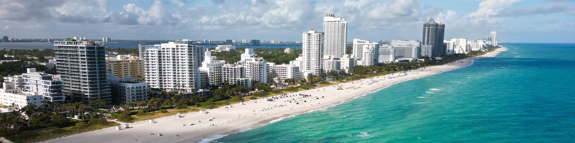 Miami cityscape with luxury skyscrapers and ocean. Panoramic view of Miami famous skyline. Miami Beach from above. Miami skyline from top.