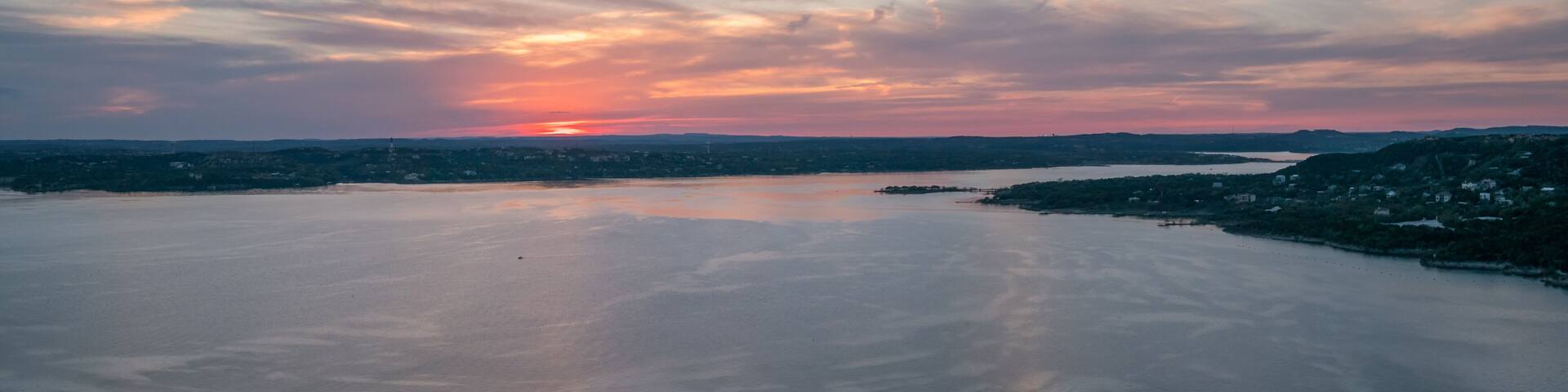 Panoramic View of Lake Travis With ColorFul Skies in the distance