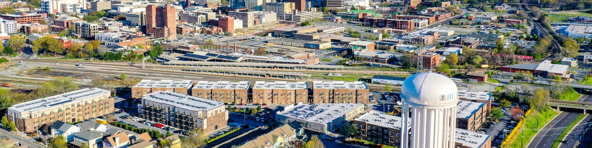 Aerial shot of Greensboro in the morning under a clear blue sky