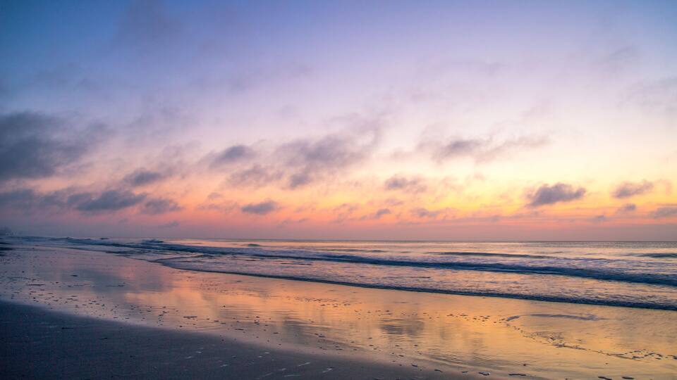 Abstract Ocean Sunrise. Defocused soft sunrise reflected in the waters of the Atlantic on the Myrtle Beach Golden Mile in South Carolina.