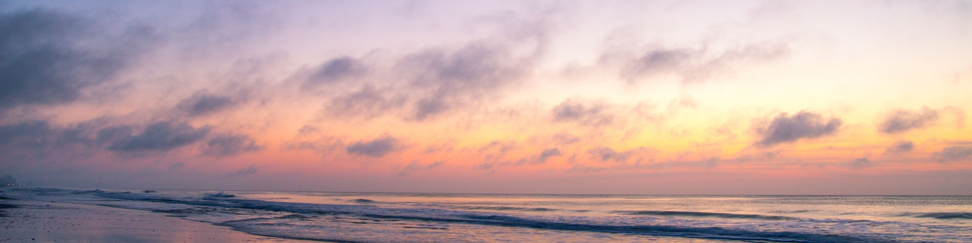 Abstract Ocean Sunrise. Defocused soft sunrise reflected in the waters of the Atlantic on the Myrtle Beach Golden Mile in South Carolina.
