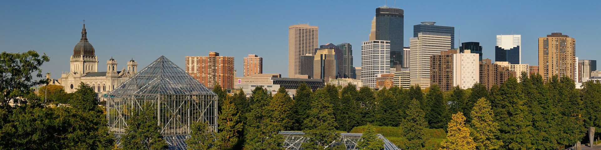 Minneapolis cityscape panorama from the Sculpture Garden Greenhouses with Cathedral and Highrise towers