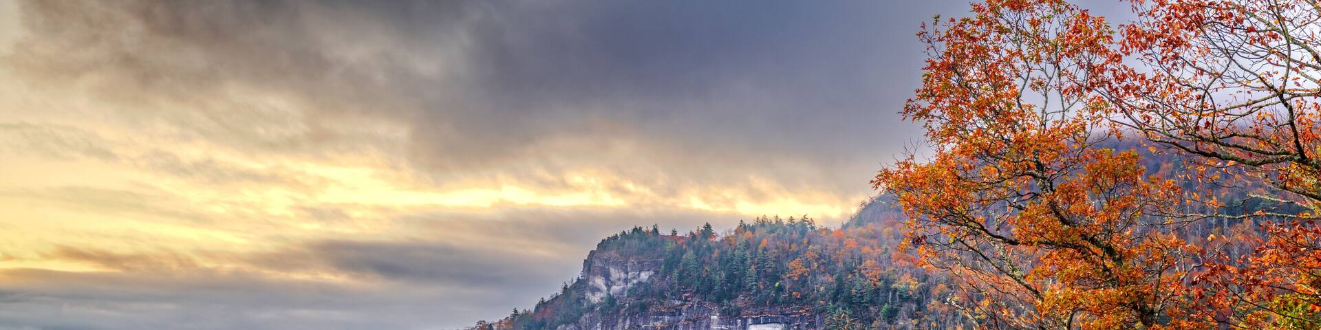 A mountainous landscape with autumn foliage.